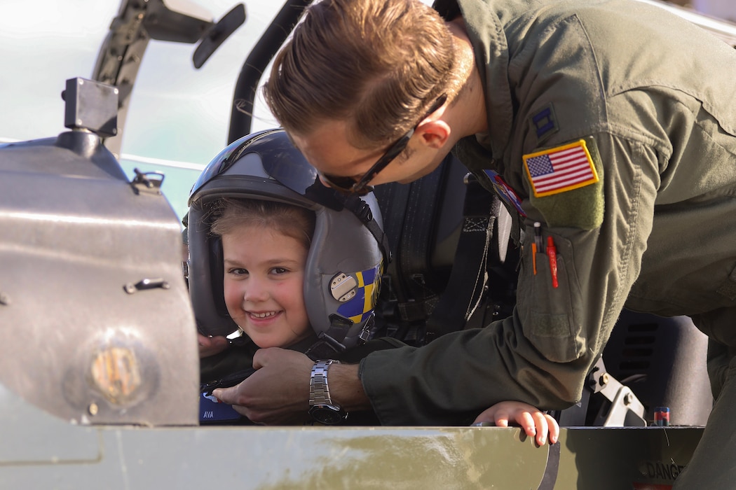 Child sitting in cockpit