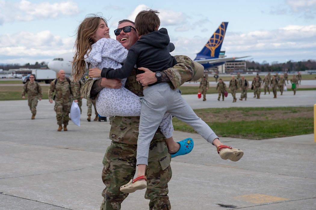 Airman celebrating with family