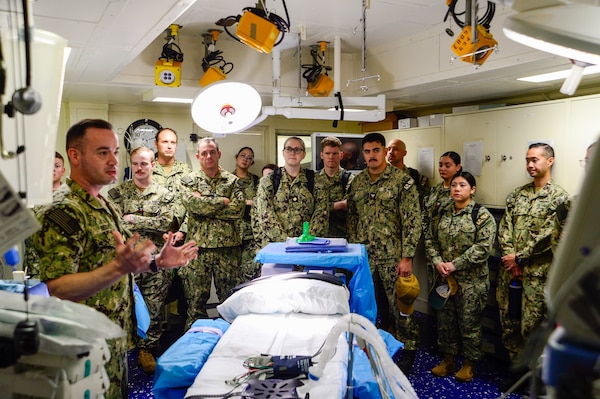 U.S. Navy Sailors assigned to Casualty Receiving Transport Ship 2 and CRTS-6 from Navy Medicine Readiness and Training Command San Diego learn the operating room's capabilities aboard USS Tripoli (LHA 7) while conducting Amphibious Familiarization Training, May 7, 2025. Shipboard familiarization increases operational readiness within the Pacific Fleet and expedtionary medicine worldwide. The mission of NMCSD is to provide a superior experience for our patients, staff, and warfighters. NMCSD employs more than 5,000 active-duty military personnel, civilians, and contractors in southern California to deliver exceptional care afloat and ashore. (U.S. Navy photo by Mass Communication Specialist 2nd Class Jacob Woitzel)