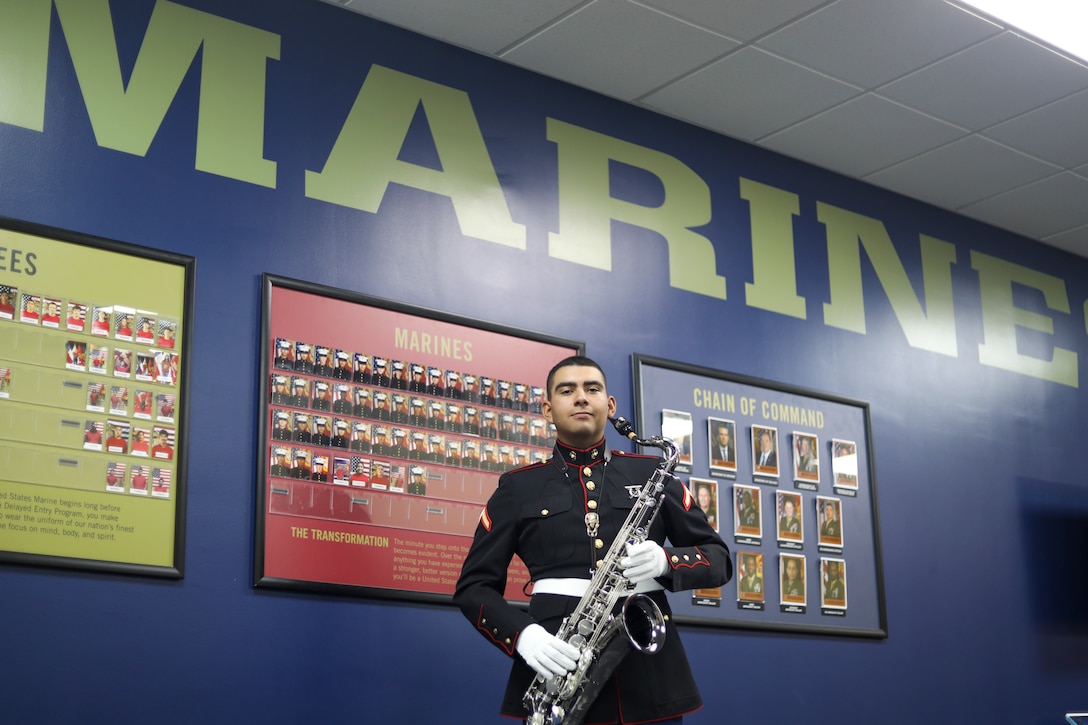 U.S. Marine Corps Pfc. Luis Rodriguez, with Recruiting Sub Station Northshore, Recruiting Station Houston, poses for a photo with his instrument at RSS Northshore in Houston, Texas, May 2, 2025. Rodriguez enlisted as an instrumentalist in the Marine Corps under the Musician Enlistment Option Program, where he will pursue a career in music while serving in the Armed Forces. (U.S. Marine Corps photo by Staff Sgt. Pedro RodriguezCastillo)
