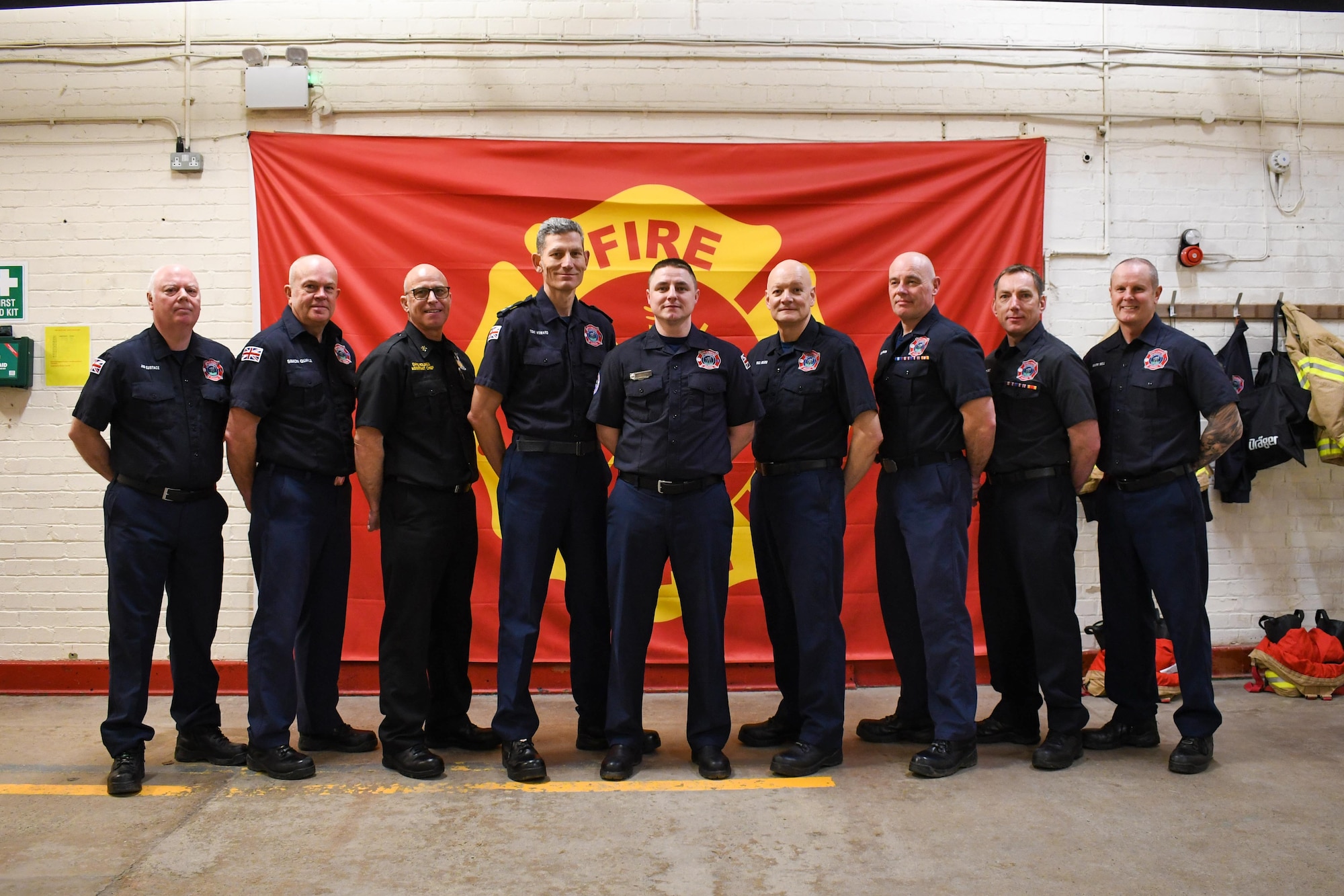 Members of the 421st Civil Engineer Flight (CEF) Fire and Emergency Services (F&ES) Blue Watch pose for a group photo