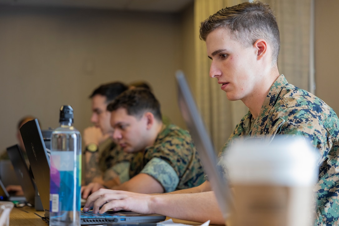 U.S. Marine Corps Lance Cpl. Anthony Hodge, cyber warfare operator, Defensive Cyberspace Operations Internal Defensive Measures, works through simulated cyber threats during exercise Southern Defender 25 in Augusta, Georgia, May 6, 2025. SD 25 is a defensive cyberspace operations focused exercise designed for the U.S. and Allies and partners to collectively strengthen cyberspace awareness, exercise joint all domain operations and counter harmful actors while building multi-lateral capacity. (U.S. Marine Corps photo by Sgt. Samuel Qin)