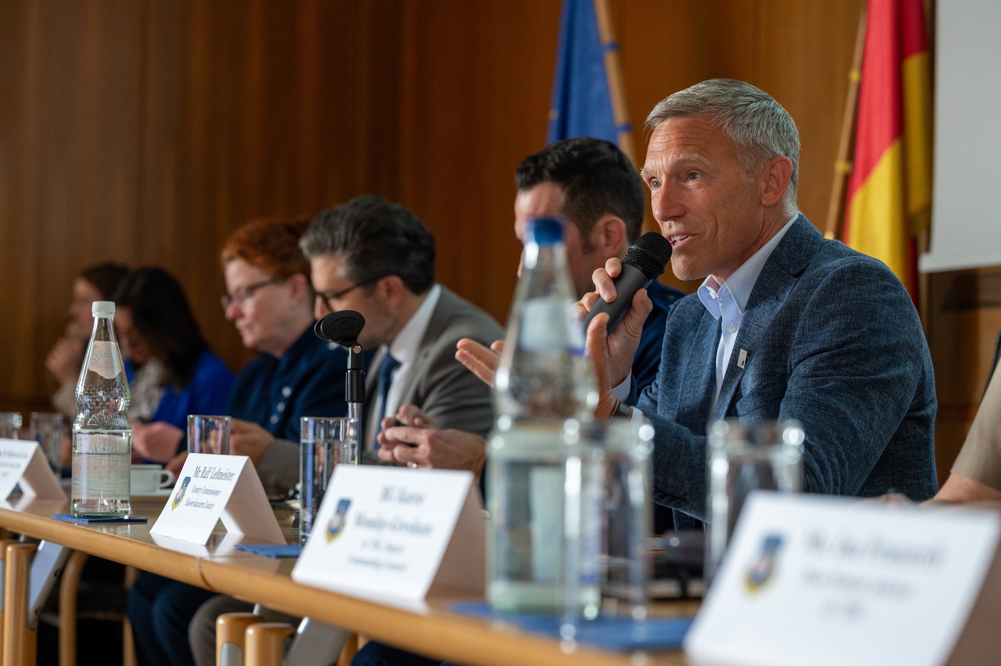 A man talks at a forum