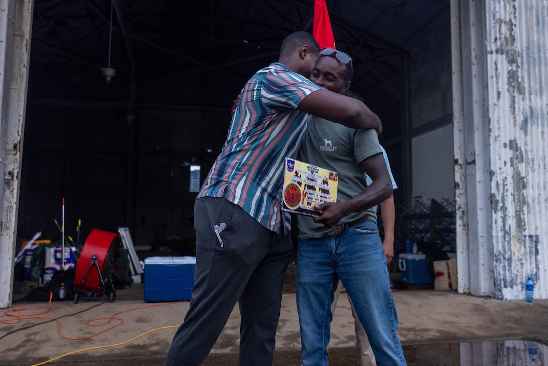 U.S. Marine Corps Cpl. Marcus McGill, a Mansfield, Louisiana native and squad leader with 1st Battalion, 8th Marine Regiment, 2d Marine Division receives a plaque from a Panamanian security force member to commemorate training together in Rodman, Panama, May 2, 2025. U.S. Southern Command is focused on increasing partner nation capacity and interoperability in the region and reflects the United States’ enduring promise of friendship, partnership, and solidarity with the Panamanian people. (U.S. Marine Corps photo by Lance Cpl. Francis Hrosar)