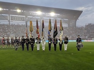 Members of the Military District of Washington Joint Armed Forces Color Guard present the colors during the national anthem prior to a DC United Football Club match at Audi Field in Washington D.C., May 3, 2025. DC United invited the Joint Armed Forces Color Guard to participate in their Military Appreciation Night and honored veterans in attendance. (U.S. Air Force photo by Staff Sgt. Brandon Schneider)
