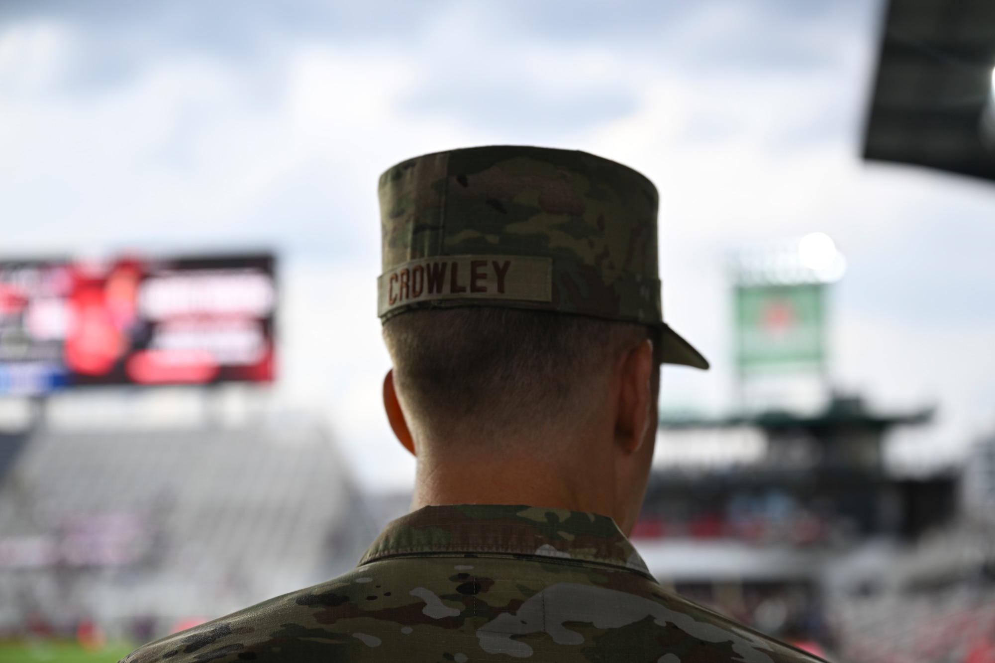U.S. Air Force Col. Ryan A.F. Crowley, commander of Joint Base Anacostia-Bolling and the 11th Wing, stands by the DC United Football Club field before the opening ceremony at Audi Field in Washington D.C., May 3, 2025. Crowley tossed the ceremonial coin that decided the first kick during the DC United vs. Colorado Rapids match. (U.S. Air Force photo by Staff Sgt. Brandon Schneider)