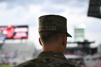 U.S. Air Force Col. Ryan A.F. Crowley, commander of Joint Base Anacostia-Bolling and the 11th Wing, stands by the DC United Football Club field before the opening ceremony at Audi Field in Washington D.C., May 3, 2025. Crowley tossed the ceremonial coin that decided the first kick during the DC United vs. Colorado Rapids match. (U.S. Air Force photo by Staff Sgt. Brandon Schneider)