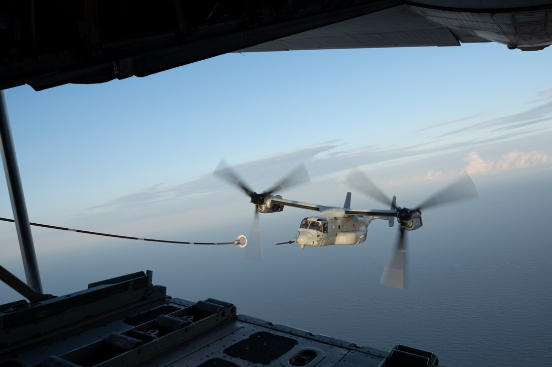 U.S. Marines with Marine Medium Tiltrotor Squadron (VMM) 261 receive fuel in an MV-22B Osprey from a KC-130J Super Hercules with Marine Aerial Refueler Transport Squadron (VMGR) 252 over the Atlantic Ocean near North Carolina, May 6, 2025. VMGR-252 conducted routine aerial refueling operations in support of VMM-261 over eastern North Carolina as part of its ongoing training continuum.
