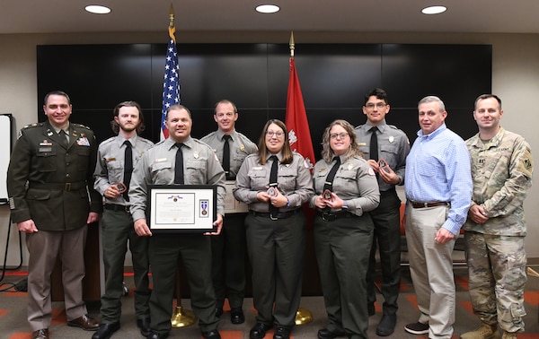 U.S. Army Corps of Engineers leaders stand with six park rangers honored for exemplary service during a recognition ceremony May 5, 2025, in Nashville, Tenn. Four received commander’s coins for their contributions to natural resource management and water safety, while two received the Department of the Army Civilian Service Achievement Medal for their dedication to ranger training and public safety. (USACE Photo by Noe Gonzalez)