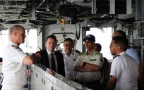 U.S. and Mauritanian military and civilian officials pose for a photo aboard the Blue Ridge-class command and control ship USS Mount Whitney (LCC 20) during a leadership engagement while anchored near Nouakchott, Mauritania, May 8, 2025.