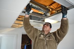Members of the D.C. Air National Guard’s 113th Wing Civil Engineer Squadron (CES) conduct HVAC diagnostics and repair, LED lighting installation, plumbing fixture placement, and electrical rewiring at the Capital Guardian Youth ChalleNGe Academy (CGYCA), in Laurel, MD, on April 12, 2025. The hands-on April 7-19 project not only offered vital Administrative Building upgrades, but also skills development. Civil engineers maintain the infrastructure for military operations ensuring they’re functional, relevant, efficient, and resilient in various operational environments.