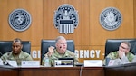 A lady talks to a military officer