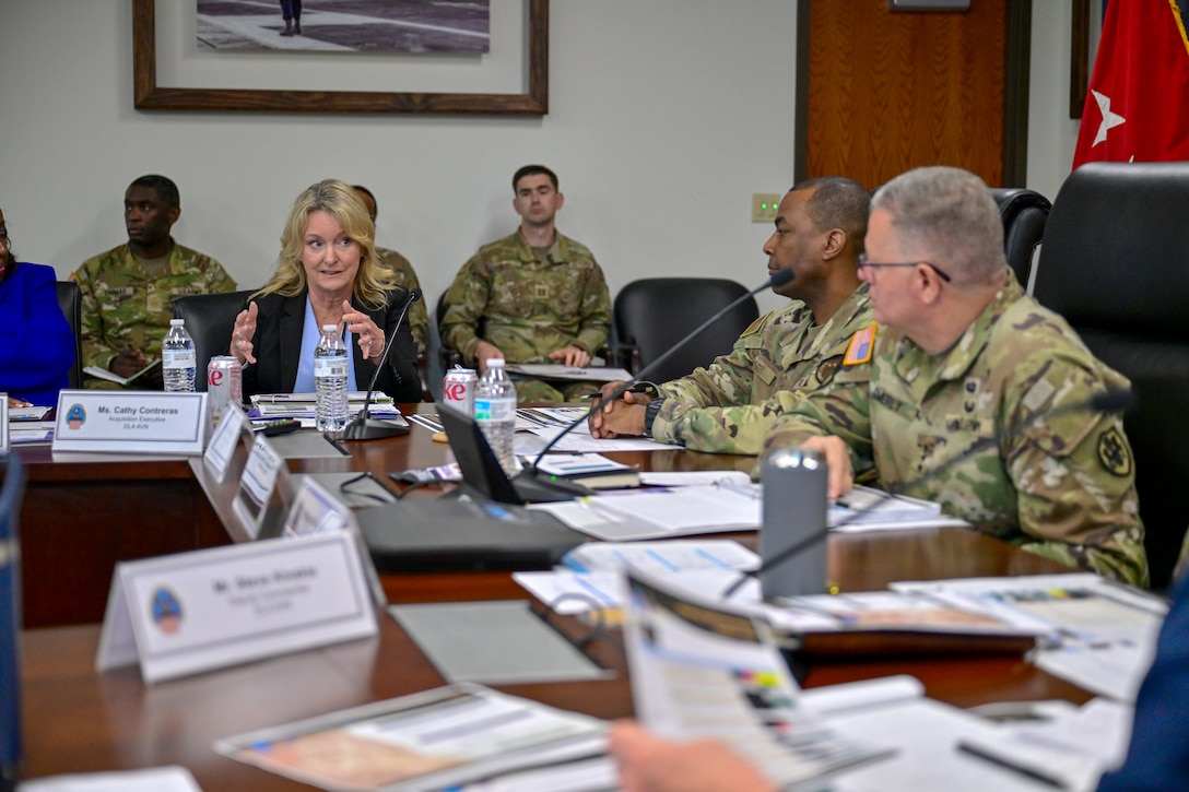 A lady talks to a military officer