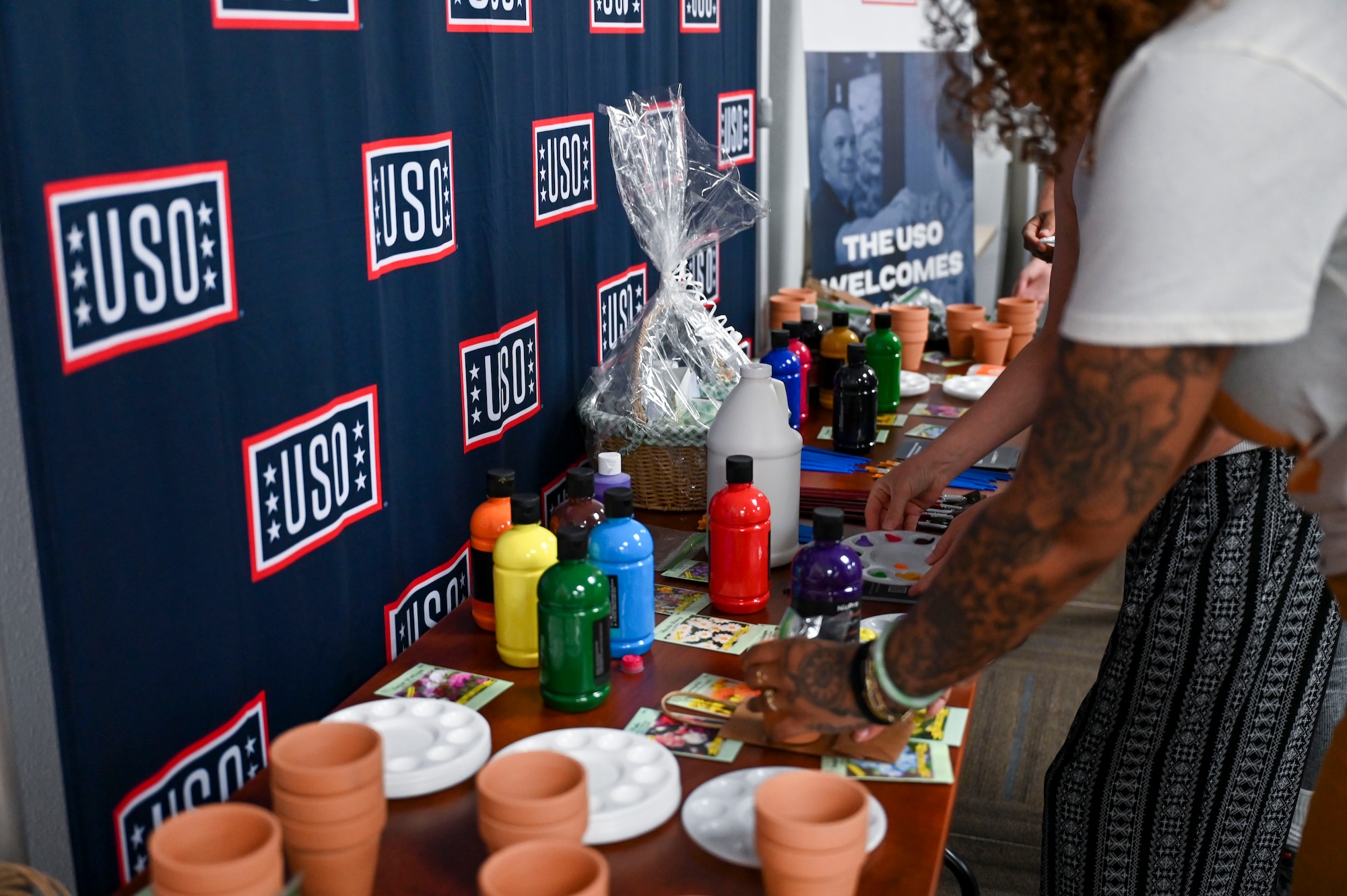 Military spouses paint plant pots during Military Spouse Appreciation Day at Holloman Air Force Base, New Mexico, May 8, 2025. Holloman AFB celebrated Military Spouse Appreciation Day with events featuring spa treatments, DIY crafts and free food. (U.S. Air Force photo by Senior Airman Michelle Ferrari)