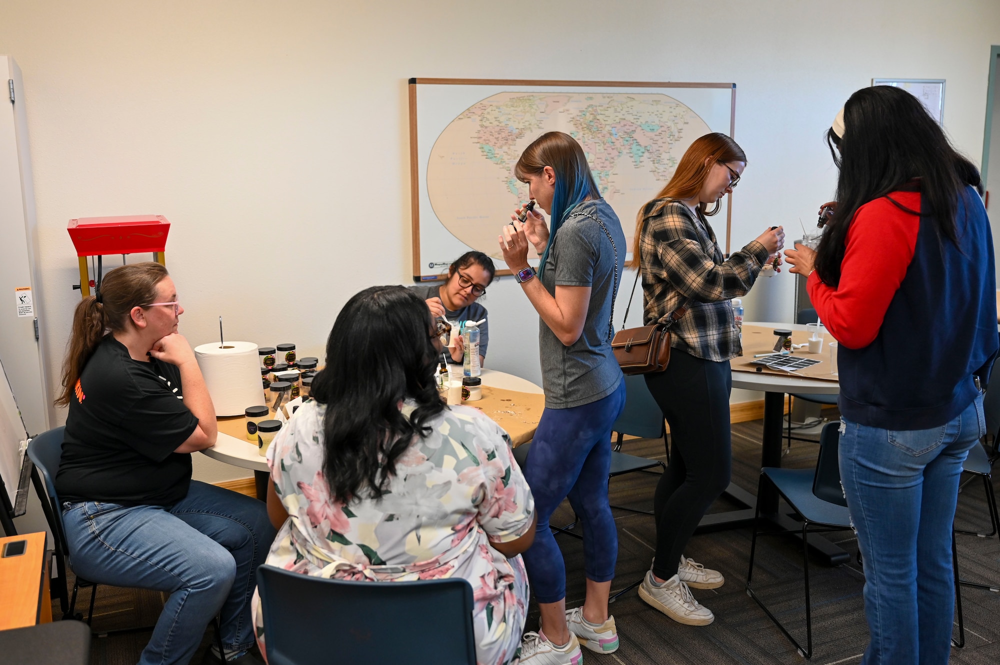 Military spouses gather to make sugar scrubs during Military Spouse Appreciation Day at Holloman Air Force Base, New Mexico, May 8, 2025. Holloman AFB celebrated Military Spouse Appreciation Day with events featuring spa treatments, DIY crafts, and free food. (U.S. Air Force photo by Senior Airman Michelle Ferrari)
