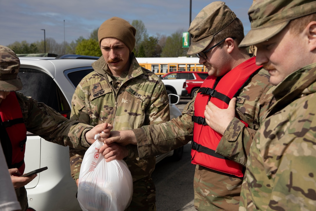 Spc. Austin Briney takes medical supplies to deliver to flood victims in Boston, Ky., Apr. 7, 2025. Soldiers with Charlie Battery, 2nd Battalion, 138th Field Artillery Brigade based in Bardstown, work with local officials to aid Nelson Countians stranded because of flood waters. The catastrophic flooding is the result of several days of heavy rainfall across the commonwealth. (U.S. Army National Guard Photo by Milt Spalding)