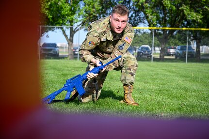 U.S Space Force Spc. 3 Kadrien Smith, Space Force Honor Guardsman, navigates a weapons course  during a tactical weapons training exercise on Joint Base Anacostia-Bolling, Washington, D.C, April 19, 2025. The event was a part of the First Term Enlisted Course which emphasized the importance of developing mission-ready Airmen, through discipline, adaptability and sharpening combat skills for future operational demands. (U.S. Air Force photo by Airman 1st Class Shanel Toussaint)