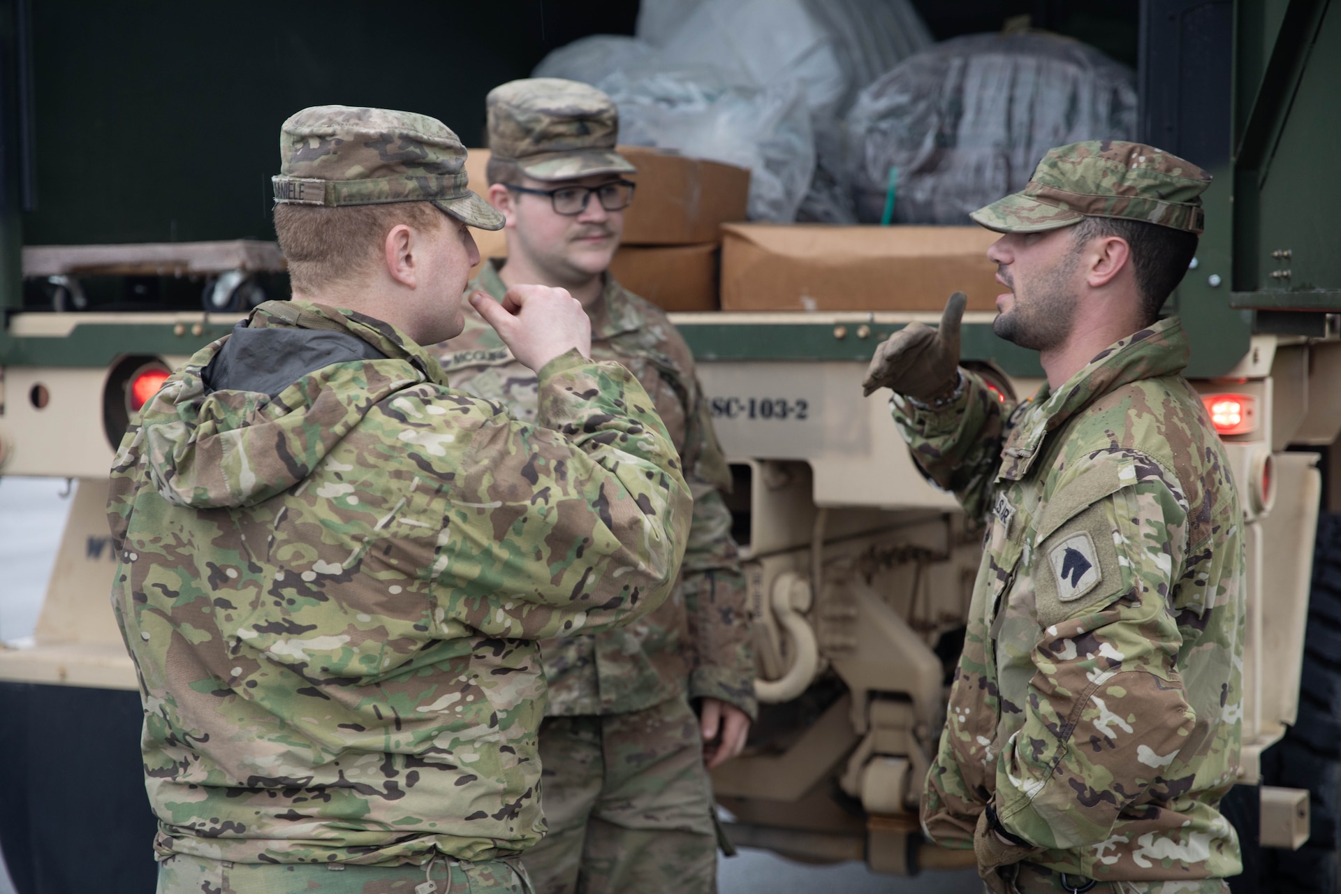 Staff Sgt. James Hamilton talks with Sgt. Michael Daniele and Sgt. Dalton McGuire before the team leaves to assist residents and emergency personnel in Boston, Ky., Apr. 5, 2025. Soldiers with Charlie Battery, 2nd Battalion, 138th Field Artillery Brigade based in Bardstown, work with local officials to aid Nelson Countians stranded because of flood waters. The catastrophic flooding is the result of several days of heavy rainfall across the commonwealth. (U.S. Army National Guard Photo by Milt Spalding)