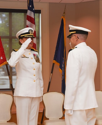Capt. Martin Braud, right, EMF-Kilo commanding officer, salutes Capt. Anja Dabelic after assuming commanding authority during the Expeditionary Medical Facility Kilo change of command ceremony at Marston Pavillion, on May 9, 2025. EMF-Kilo is the readiness platform attached to Navy Medicine Readiness and Training Command Camp Lejeune and is comprised of approximately 400 personnel ready to deploy field hospital capabilities during humanitarian or combat mission.