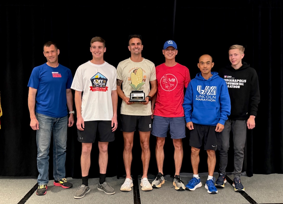 Members of the Kentucky National Guard Marathon Team earned "The Cob" for winning their first team championship at the All-Guard Marathon Time Trials during the Lincoln Marathon, May 4, 2025.
