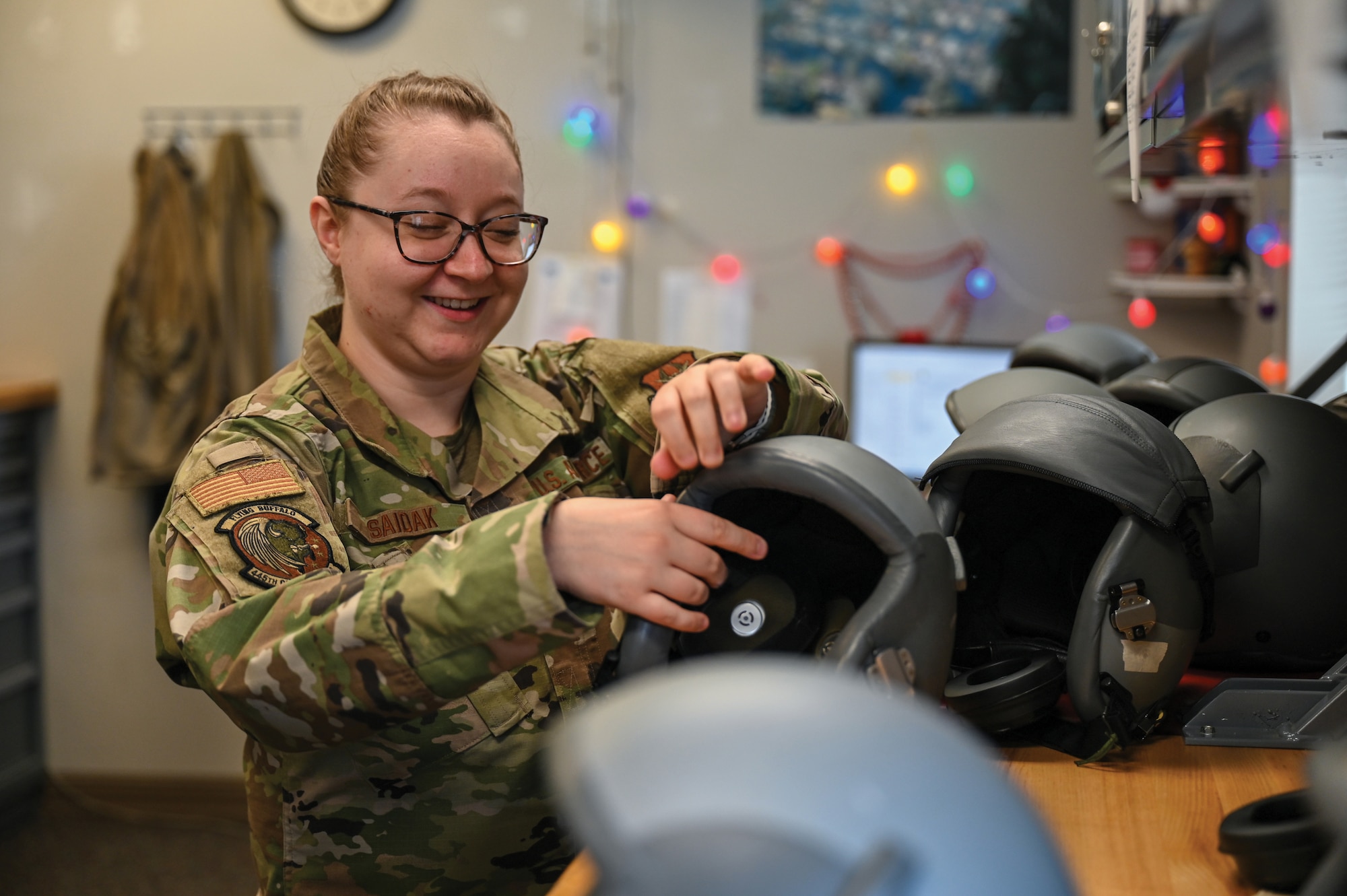 U.S. Air Force Staff Sgt. Gabrielle Saidak, 445th Operations Support Squadron aircrew flight equipment technician, inspects HGU-55/p helmets for defects or other damages at Wright-Patterson Air Force Base, Ohio, March 23, 2025. (U.S. Air Force photo by Master Sgt. Patrick O'Reilly)