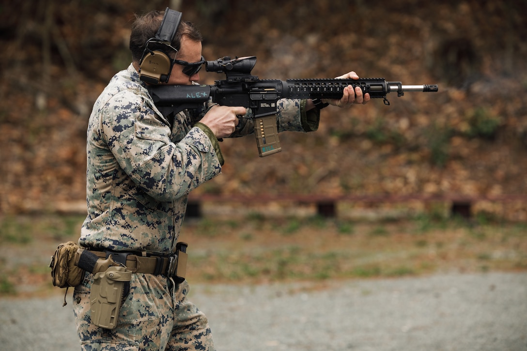 U.S. Marine Corps Staff Sgt. William Blakeley, a counterintelligence/human intelligence specialist with 2nd Intelligence Battalion, 2nd Marine Information Group, 2nd Marine Expeditionary Force, shoots an M16 rifle as a part of the multi-weapon match during the Marine Corps Championships hosted by Weapons Training Battalion, on Marine Corps Base Quantico, Virginia, April 12, 2025. This competition brings together top shooters from regional marksmanship events to test their skills in precision rifle, action rifle, action pistol, and multi-gun action shooting. It continues the legacy of the Marine Corps Shooting Team, which has upheld marksmanship excellence since the early 1900s and reinforces the Corps' commitment to marksmanship as a core warfighting skill. (U.S. Marine Corps photo by Cpl. Joshua Barker)