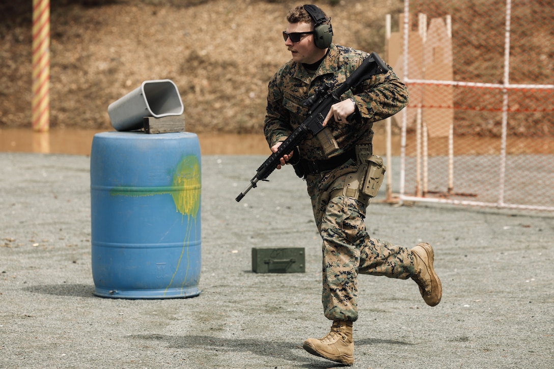 U.S. Marine Corps Cpl. Nathan Sypeck, an electrical systems technician with Marine Ariel Refueler Transport Squadron 234, Marine Air Group 24, 4th Marine Air Wing, sprints to an obstacle as a part of the multi-weapon match during the Marine Corps Championships hosted by Weapons Training Battalion, on Marine Corps Base Quantico, Virginia, April 12, 2025. This competition brings together top shooters from regional marksmanship events to test their skills in precision rifle, action rifle, action pistol, and multi-gun action shooting. It continues the legacy of the Marine Corps Shooting Team, which has upheld marksmanship excellence since the early 1900s and reinforces the Corps' commitment to marksmanship as a core warfighting skill. (U.S. Marine Corps photo by Cpl. Joshua Barker)