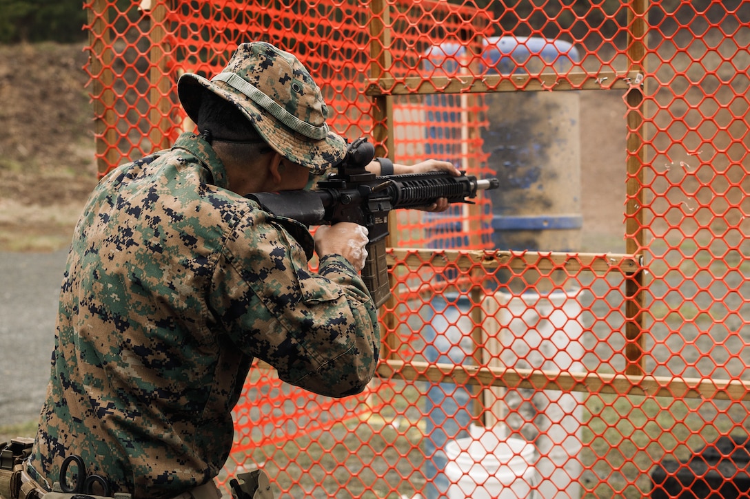 U.S. Marine Corps Cpl. Josue Gudiel, a marksmanship coach with Weapons and Field Training Battalion, Marine Corps Recruit Depot San Diego, shoots an M16 rifle as a part of the multi-weapon match during the Marine Corps Championships hosted by Weapons Training Battalion, on Marine Corps Base Quantico, Virginia, April 12, 2025. This competition brings together top shooters from regional marksmanship events to test their skills in precision rifle, action rifle, action pistol, and multi-gun action shooting. It continues the legacy of the Marine Corps Shooting Team, which has upheld marksmanship excellence since the early 1900s and reinforces the Corps' commitment to marksmanship as a core warfighting skill. (U.S. Marine Corps photo by Cpl. Joshua Barker)