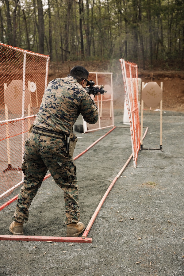 U.S. Marine Corps Gunnery Sgt. Cody Rader, a Marine Combat Instructor with the School of Infantry West shoots an M16 rifle as a part of the multi-weapon match during the Marine Corps Championships hosted by Weapons Training Battalion, on Marine Corps Base Quantico, Virginia, April 12, 2025. This competition brings together top shooters from regional marksmanship events to test their skills in precision rifle, action rifle, action pistol, and multi-gun action shooting. It continues the legacy of the Marine Corps Shooting Team, which has upheld marksmanship excellence since the early 1900s and reinforces the Corps' commitment to marksmanship as a core warfighting skill. (U.S. Marine Corps photo by Cpl. Joshua Barker)