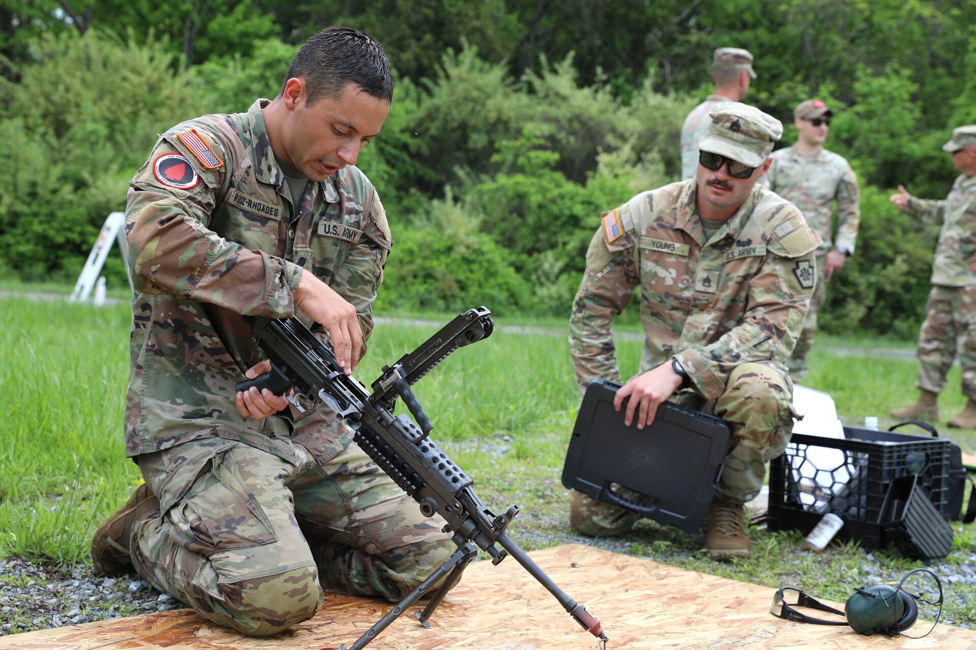 Spc. Robert Ruiz-Rhoades of the Pennsylvania National Guard's 28th Expeditionary Combat Aviation Brigade assembles an M249 light machine gun during the Region II Best Warrior Competition at Fort Indiantown Gap, Pennsylvania, May 8, 2025. (U.S. Army National Guard photo by Spc. Annie M. Riley)