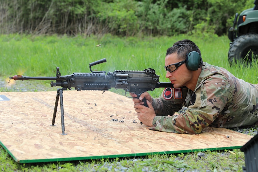 Spc. Robert Ruiz-Rhoades of the Pennsylvania National Guard's 28th Expeditionary Combat Aviation Brigade fires an M249 light machine gun during the Region II Best Warrior Competition at Fort Indiantown Gap, Pennsylvania, May 8, 2025. (U.S. Army National Guard photo by Spc. Annie M. Riley)