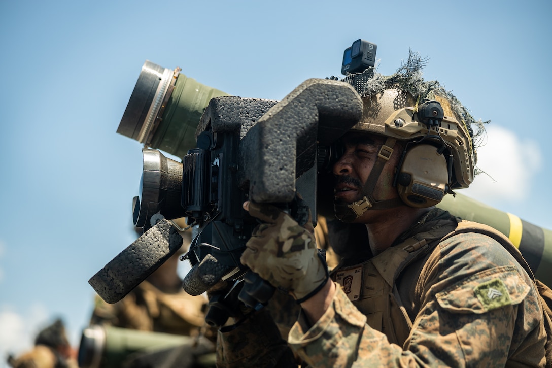U.S. Marines Corps Cpl. Nycorian Allen, a native of Georgia and an anti-tank missileman with 3d Littoral Combat Team, 3d Marine Littoral Regiment, 3d Marine Division, looks through a M98A2 command launch unit during the  counter-landing live-fire event of Exercise Balikatan 25 in Aparri, Philippines, May 3, 2025. This training was conducted alongside U.S. Soldiers with 25th Infantry Division, Philippine Marines with Marine Battalion Landing Team 10, and Philippine Soldiers with Army Artillery Regiment and the Philippine Army Armored Division. Balikatan is a longstanding annual exercise between the Armed Forces of the Philippines and U.S. military designed to strengthen our ironclad alliance, improve our capable combined force, and demonstrate our commitment to regional security and stability. (U.S. Marine Corps photo by Cpl. Malia Sparks)
