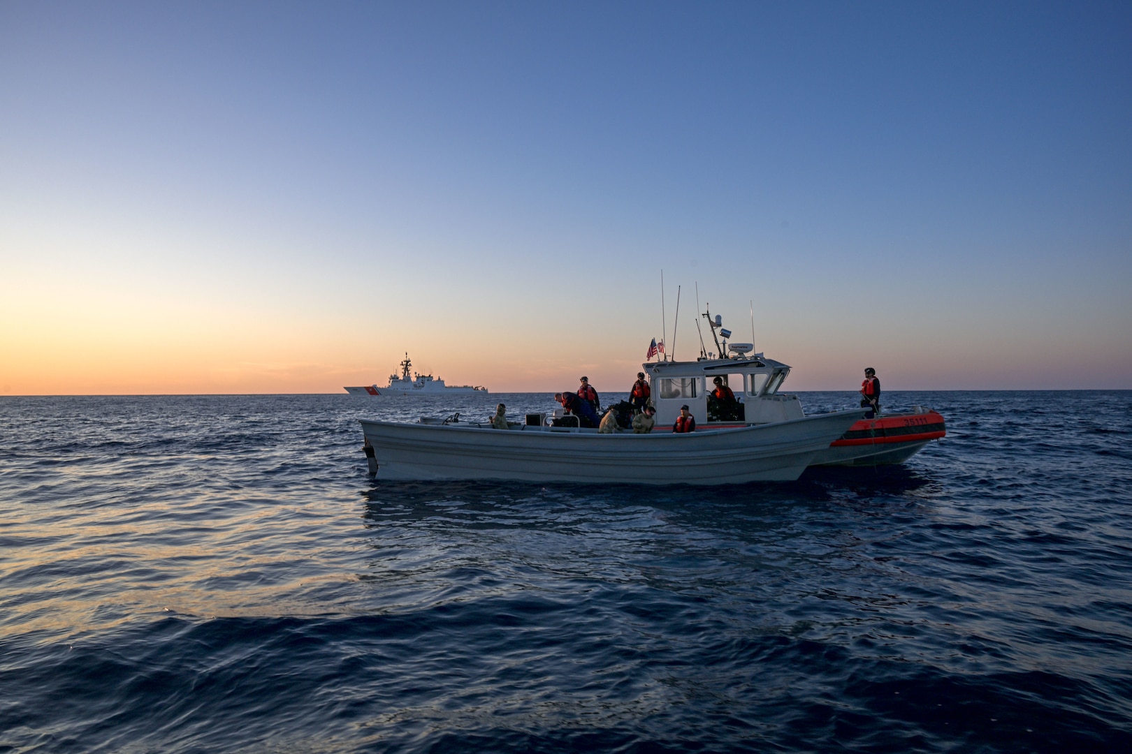 U.S. Coast Guard Cutter Kimball (WMSL 756) crewmembers seize cocaine bails from a go-fast vessel interdicted in the Eastern Pacific Ocean, March 3, 2025. Kimball is one of two Legend-class national security cutters homeported in Honolulu capable of globally deploying to protect America’s maritime borders, territorial integrity, and sovereignty. (U.S. Coast Guard photo by Petty Officer 3rd Class Austin Wiley)