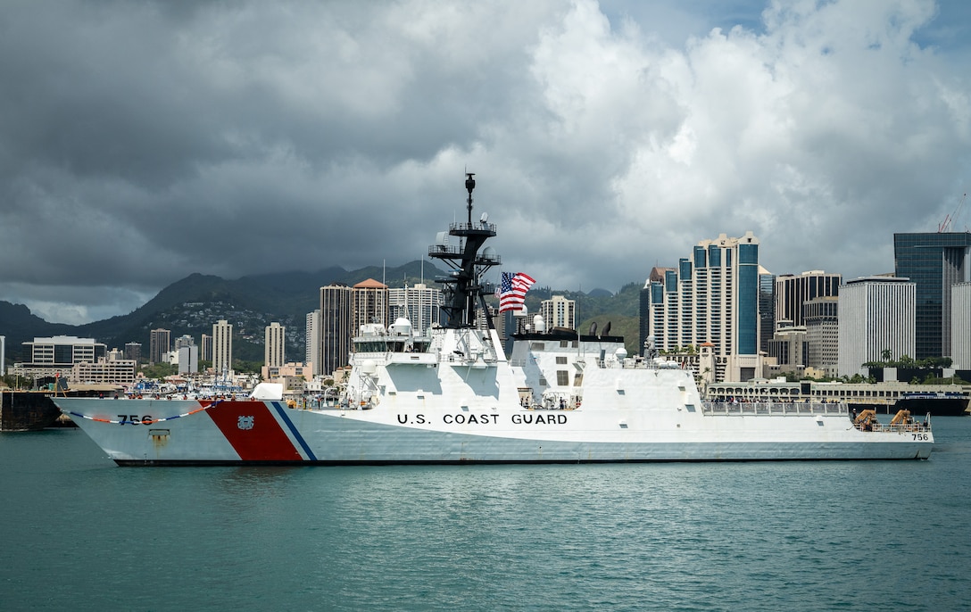 U.S. Coast Guardsmen assigned to the national security cutter USCGC Kimball (WMSL 756) maneuver the ship to the pier on Coast Guard Base Honolulu May 5, 2025. The cutter's crew returned from an 84-day Eastern Pacific patrol. (U.S. Coast Guard photo by Petty Officer 2nd Class Tyler Robertson)