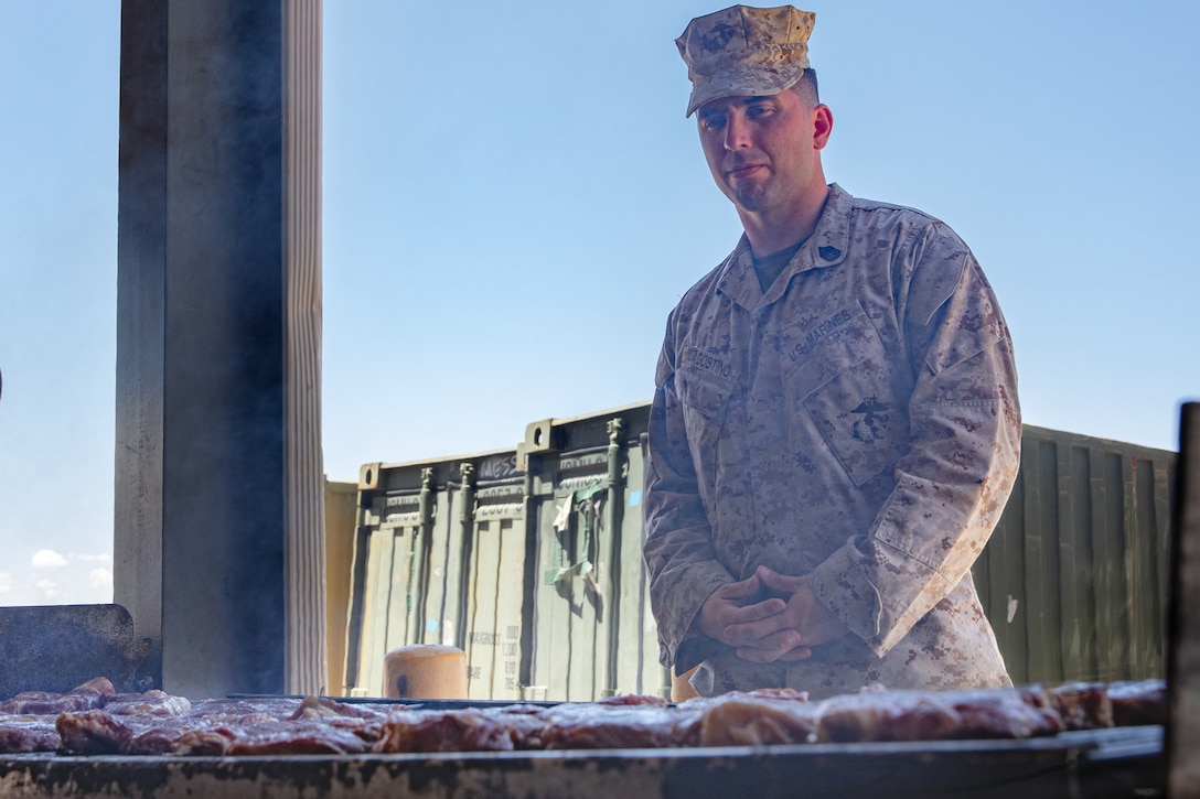 U.S. Marine Corps Gunnery Sgt. Taylor J. Dagostino, mess management chief, Headquarters Company, 23rd Marine Regiment, 4th Marine Division, prepares food for the warrior meal at Integrated Training Exercise 4-24, Marine Corps Air-Ground Combat Center, Twentynine Palms, California, June 23, 2024. Active and reserve component integration is vital to sharing knowledge and demonstrating how the two support each other. Reserve Marines and Sailors have come together from across the nation to form an integrated Marine Air-Ground Task Force to take part in a live-fire, combined arms exercise that will better prepare Marine Forces Reserve in its mission to augment and reinforce the active component. (U.S. Marine Corps photo by Orion Stpierre)