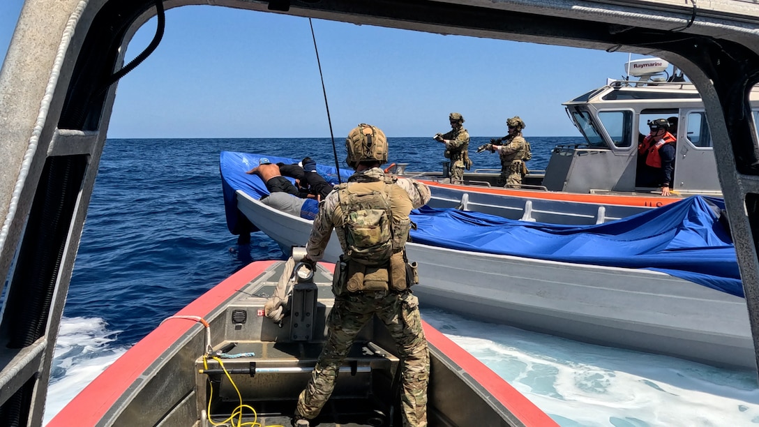Maritime enforcement specialists from Tactical Law Enforcement Team South and U.S. Coast Guard Cutter Kimball (WMSL 756) crewmembers interdict a suspected drug smuggling vessel while patrolling the Eastern Pacific Ocean, March 4, 2025. The U.S. Coast Guard is increasing its presence in key areas to secure the U.S. maritime border against the flow of cocaine, fentanyl, and other illegal drugs. (U.S. Coast Guard photo by Petty Officer 2nd Class Max Hanfland)