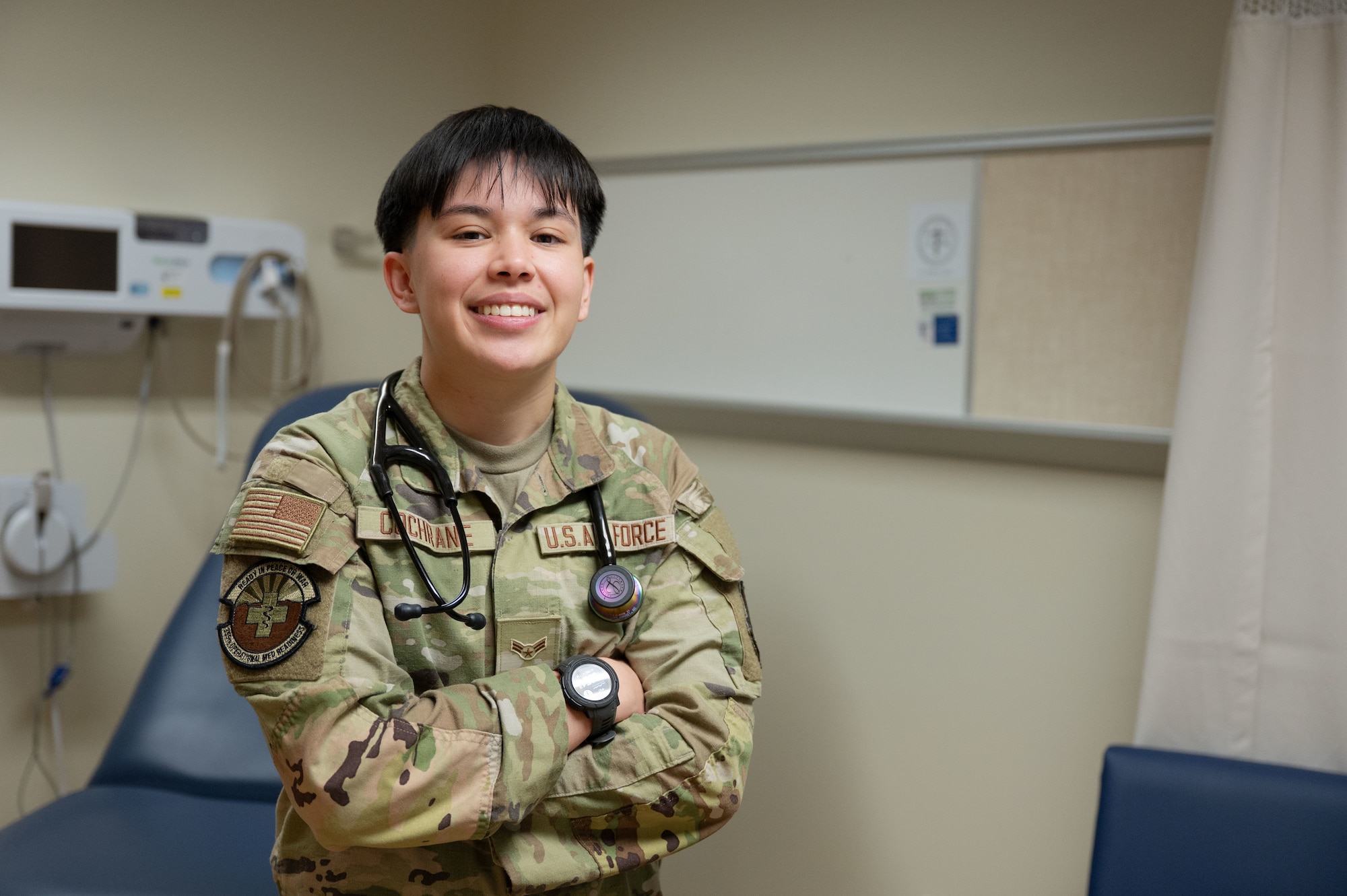 U.S. Air Force Airman 1st Class Kaisy Cochrane, 355th Medical Group aerospace medical technician, poses for a photo at Davis-Monthan Air Force Base, Arizona, May 7, 2025. Cochrane greets patients, takes vitals and gathers medical history before they meet with providers. (U.S. Air Force photo by Airman Jaden Kidd)
