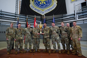 U.S. Air Force Lt. Gen. Rebecca Sonkiss, far left, Air Mobility Command deputy commander, and the 521st Air Mobility Operations Wing command team pose for a photo with members of the 305th Aircraft Maintenance Squadron from Joint Base McQuire-Dix-Lakehurst, N.J., who were named the champions of the 521st AMOW’s Mobility Vanguard 2025 at Ramstein Air Base, Germany, April 25, 2025. Mobility Vanguard featured several strategic evaluations for 22 military aerial port and maintenance teams from across the U.S. Air Force, Germany, and the Netherlands, with a focus on daily mobility aircraft generation. (U.S. Air Force photo by Staff Sgt. Joshua T. Crossman)