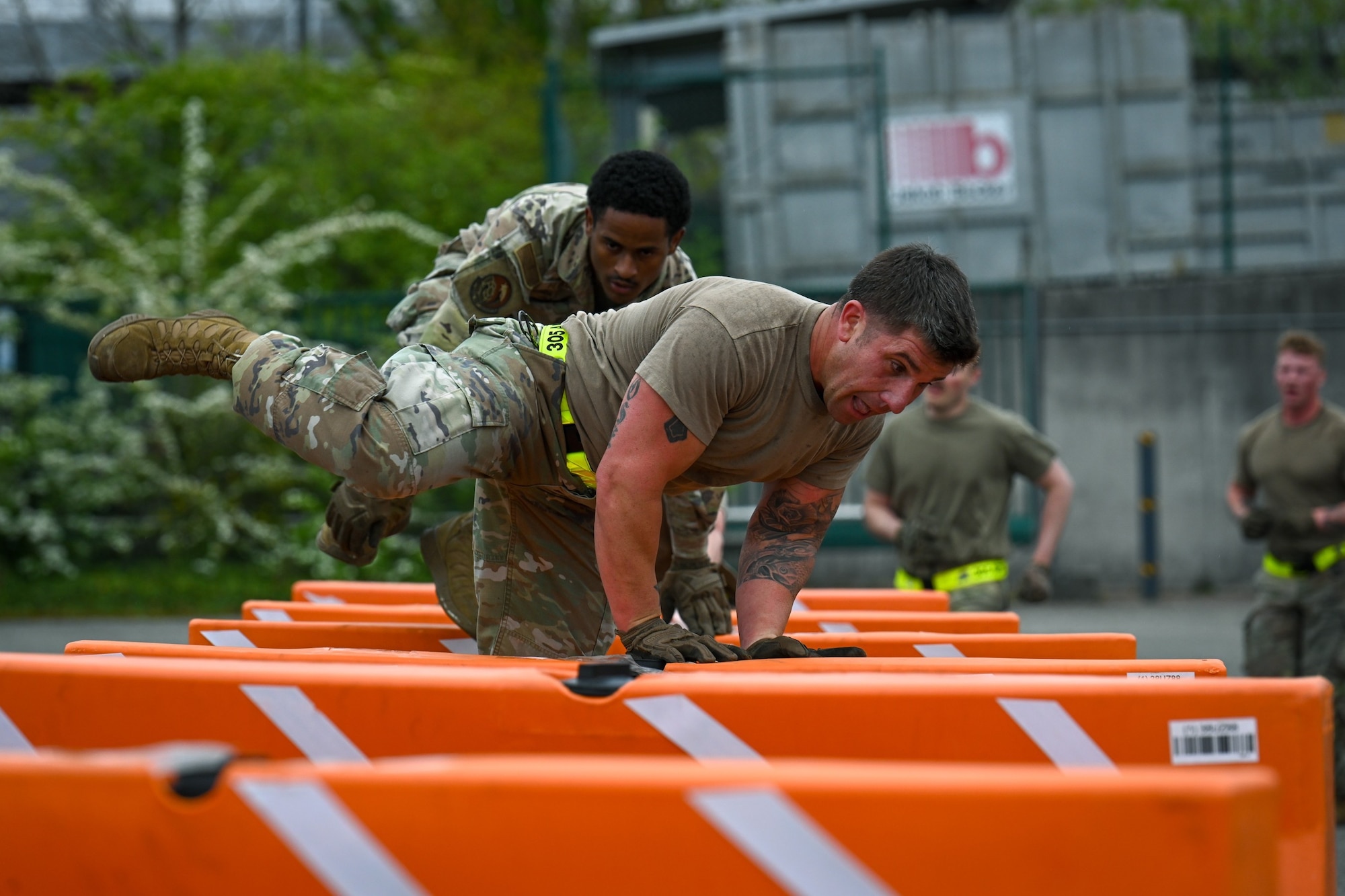 U.S. Air Force Airmen assigned to the 305th Aerial Port Squadron, from Joint Base McGuire-Dix-Lakehurst, N.J., participate in the Combat Fitness Challenge during the 521st Air Mobility Operations Wing Mobility Vanguard 2025 at Ramstein Air Base, Germany, April 25, 2025. Mobility Vanguard featured several strategic evaluations for 22 military aerial port and maintenance teams from across the U.S. Air Force, Germany, and the Netherlands, with a focus on daily mobility aircraft generation. (U.S. Air Force photo by Staff Sgt. Joshua T. Crossman)