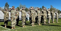 Nevada Army Guard Recruiting and Retention Battalion Soldiers salute during a recent event in Northern Nevada. The entire Recruiting and Retention Battalion team is enjoying a successful 2025 retention campaign, having already met 56 percent of its 2025 retention goal.