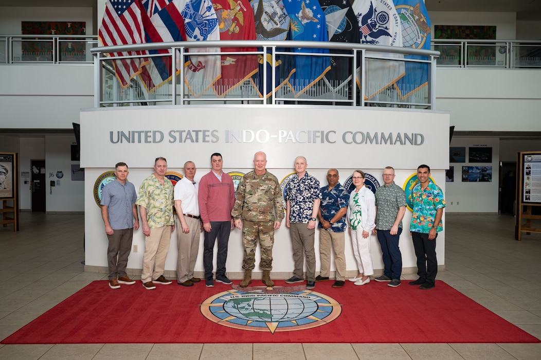 U.S. Air Force Maj. Gen. Joel Carey, chief of staff for U.S. Indo-Pacific Command, joins the National Defense University Capstone 25-3 Fellows for a group photo at the USINDPACOM headquarters on Camp H.M. Smith in Honolulu, May 9, 2025.