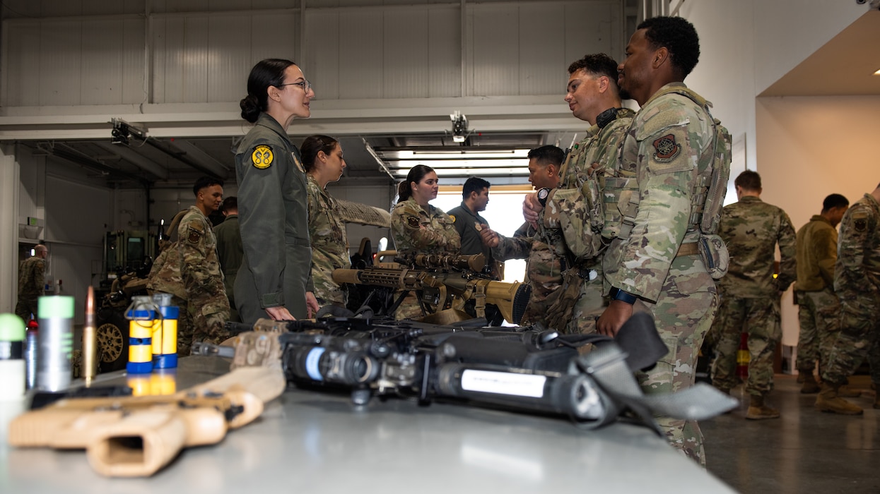 Airmen display firearms for cadets to view