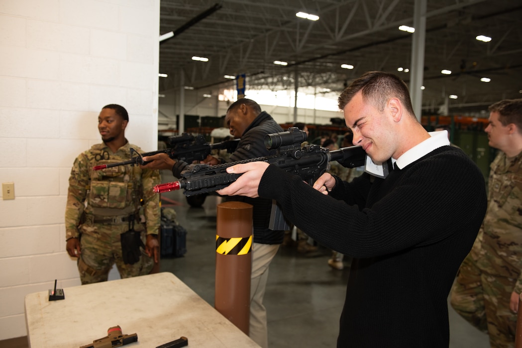 Cadet fires laser targeting weapon