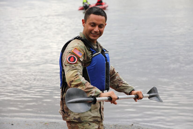 Spc. Robert Ruiz-Rhoades of the Pennsylvania National Guard's 28th Expeditionary Combat Aviation Brigade prepares for the kayaking event during the Region II Best Warrior Competition in Harrisburg, Pennsylvania, May 6, 2025. (U.S. Army National Guard photo by Spc. Annie M. Riley)