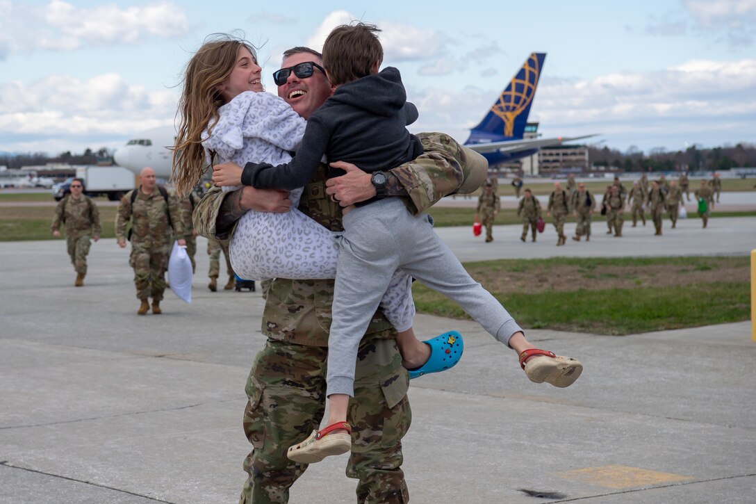 Airman celebrating with family