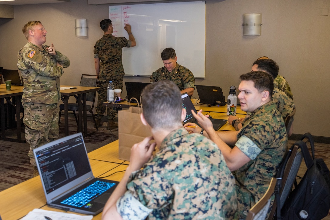 U.S. service members conduct defensive cyber operations during exercise Southern Defender 25 in Augusta, Georgia, May 6, 2025. SD 25 is a defensive cyberspace operations focused exercise designed for the U.S. and Allies and partners to collectively strengthen cyberspace awareness, exercise joint all domain operations and counter harmful actors while building multi-lateral capacity. (U.S. Marine Corps photo by Sgt. Samuel Qin)