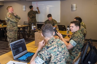 U.S. service members conduct defensive cyber operations during exercise Southern Defender 25 in Augusta, Georgia, May 6, 2025. SD 25 is a defensive cyberspace operations focused exercise designed for the U.S. and Allies and partners to collectively strengthen cyberspace awareness, exercise joint all domain operations and counter harmful actors while building multi-lateral capacity. (U.S. Marine Corps photo by Sgt. Samuel Qin)