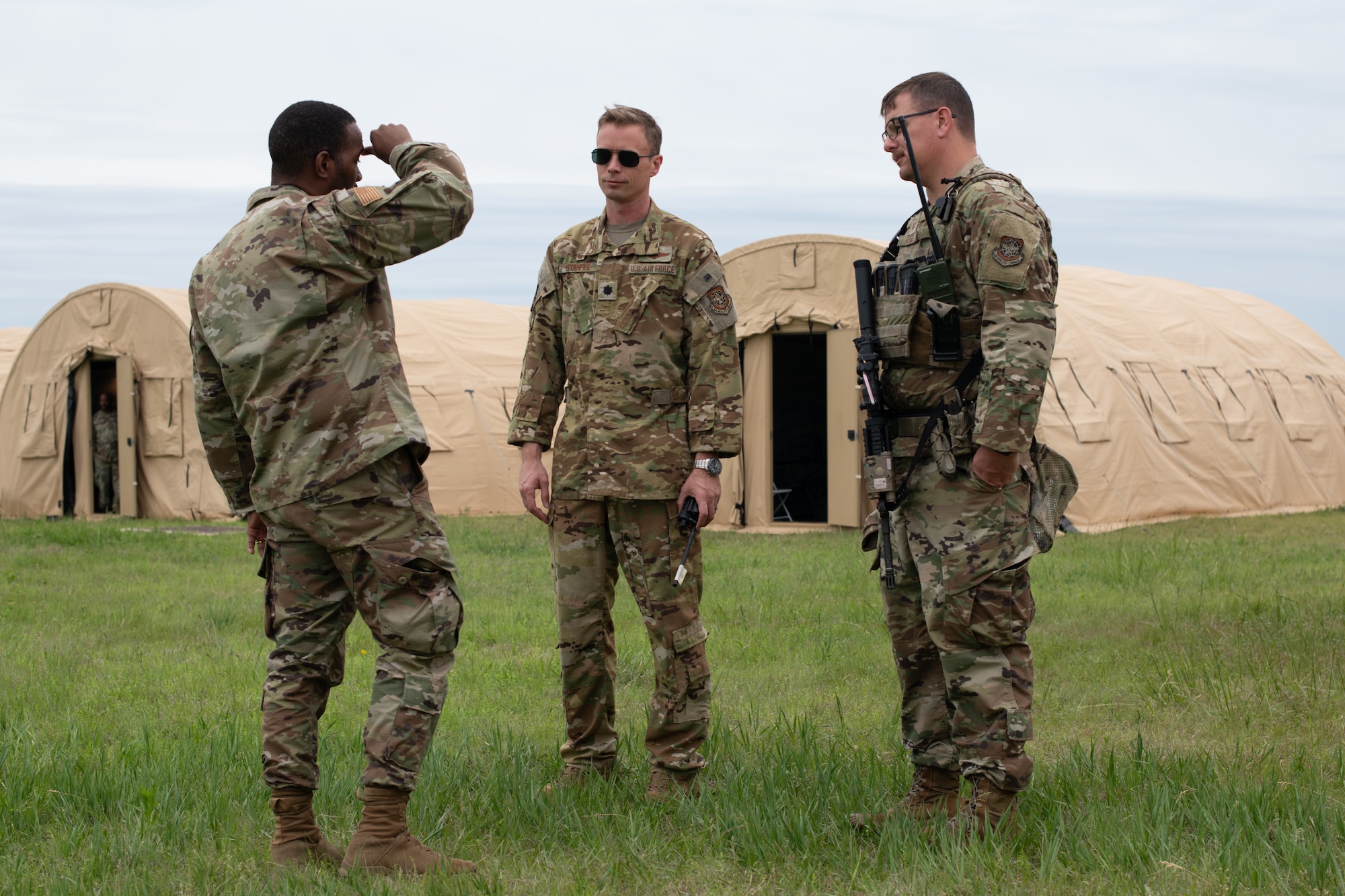 From left, Capt. David Kilpatrick, 507th Air Refueling Wing Air Force Reserve Command Chaplain, Lt. Col. Ryan Stanfill, 349th Air Refueling Squadron commander, and Master Sgt. Timothy Hessel, 22nd Security Forces Squadron patrolman, participate in Exercise Lethal Stack at McConnell Air Force Base, Kansas, May 6, 2025. 22nd Air Refueling Wing and Air Force Reserve Command personnel worked alongside each other during Lethal Stack, testing their interoperability throughout the deployment process. (U.S. Air Force photo by Senior Airman Amelio Brown)
