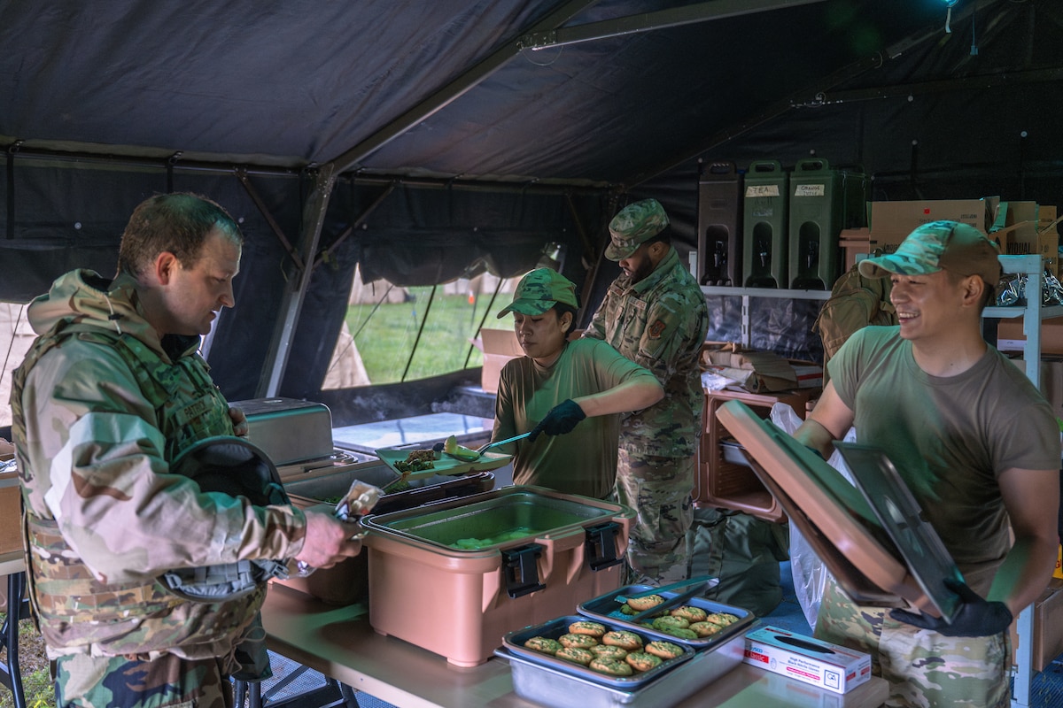 Team McConnell Airmen participate in Exercise Lethal Stack at McConnell Air Force Base, Kansas, May 7, 2025. Spaghetti, green beans, and pears were served at Lethal Stack’s meal tent. (U.S. Air Force photo by Airman 1st Class Paula Arce)