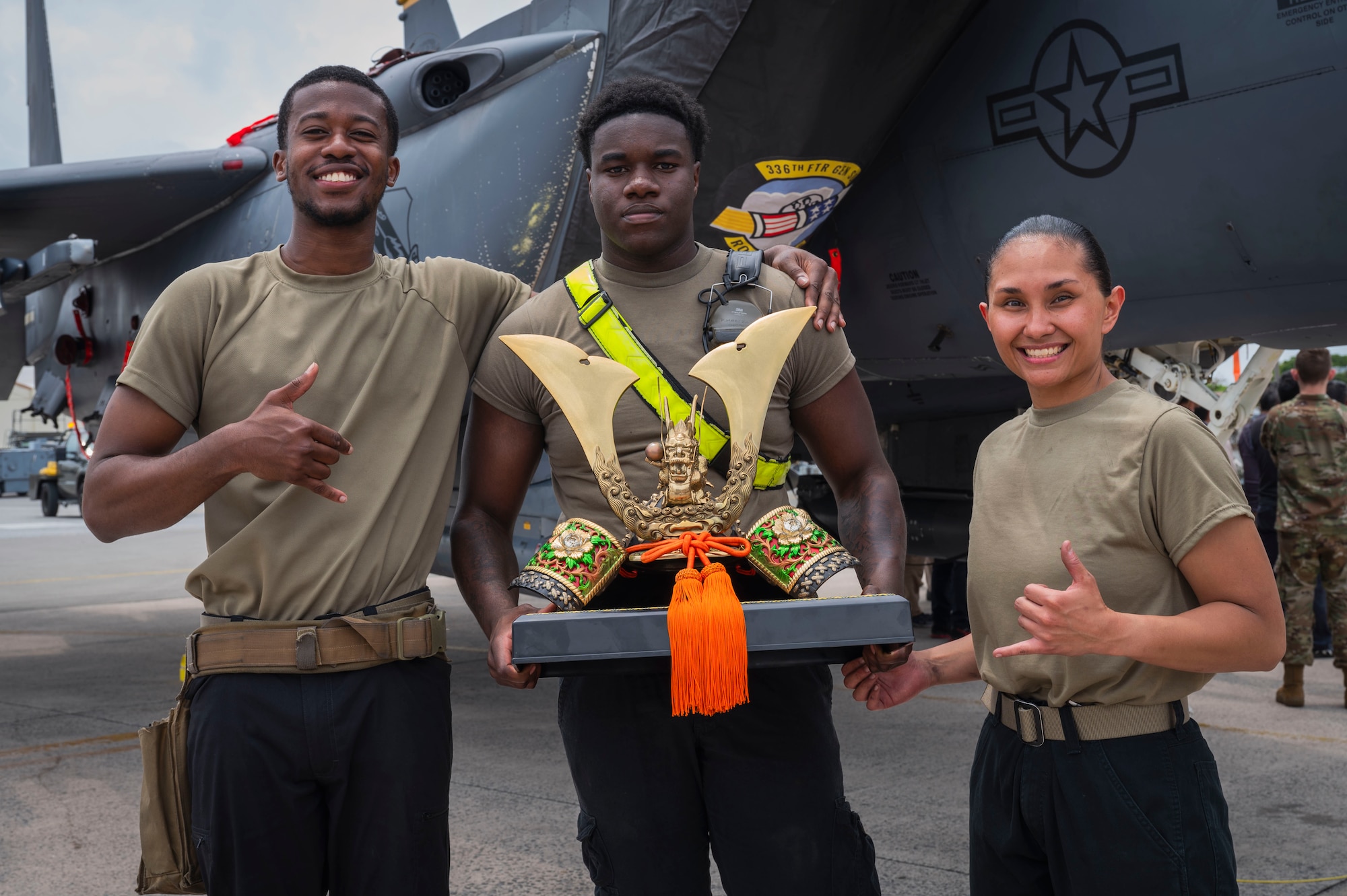 From left, U.S. Air Force Senior Airman Semar Edwards, Senior Airman Fredarious Martin, 336th Fighter Generation Squadron load crew members, and Staff Sgt. Cierra-Nae Hanson, 336th FGS load crew chief, pose for a photo with an award after winning a quarterly load competition